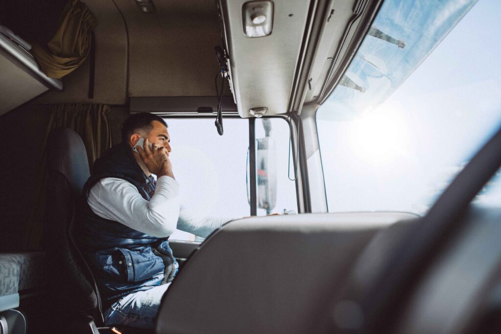 a-man-listening-to-phone-call-while-driving-truck