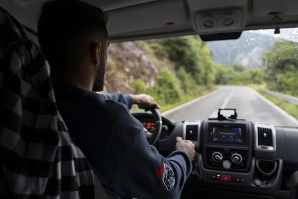 Man Driving his Truck on a Hilly Road